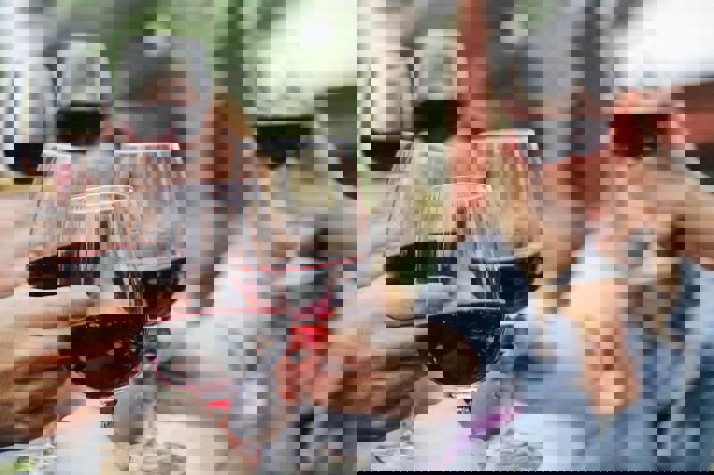 People Sat Around Together Drinking English Wine.jpg