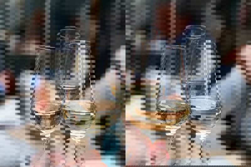 Three Glasses Of English Wine Being Help Next To Eachother.jpg