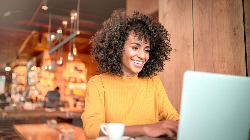 Lady at laptop in restaurant